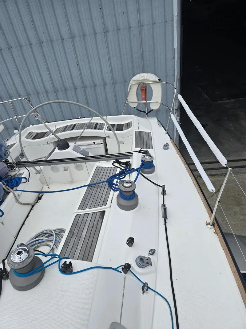 Slide: The Image of Beneteau First 40.7 sailboat deck, 2000 model, featuring winches and steering wheel. - 8