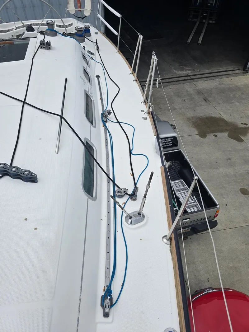 Slide: The Image of Beneteau First 40.7 sailboat deck, 2000 model, with rigging and railing details. - 9