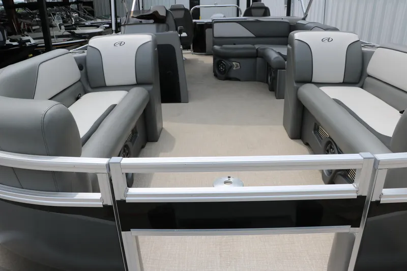 Slide: The Image of 2023 Avalon Venture 2385 RF pontoon boat interior with gray seating and helm. - 15