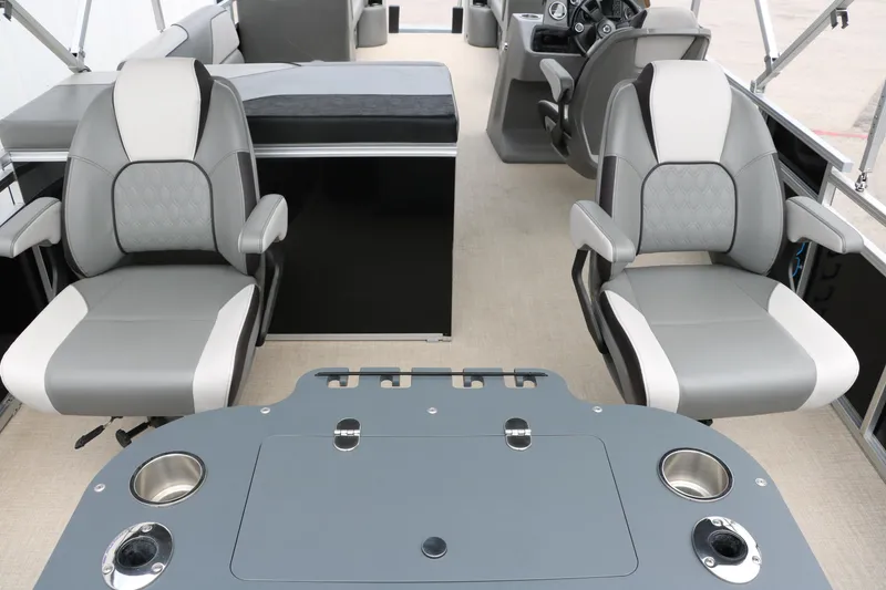 Slide: The Image of 2023 Avalon Venture 2385 RF interior with modern seating and steering console. - 20