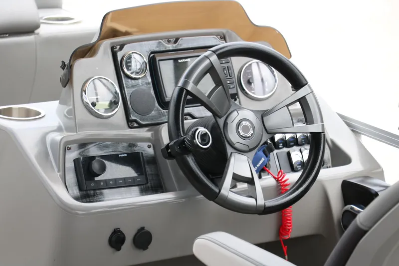Slide: The Image of 2023 Avalon Venture 2385 RF pontoon boat interior with modern seating and steering console. - 21