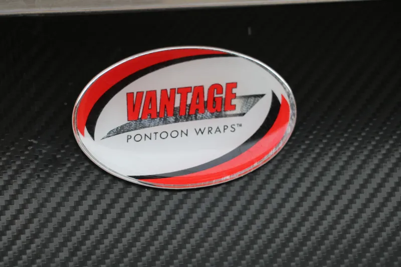 Slide: The Image of Vantage Pontoon Wraps logo on carbon fiber background, Avalon Venture 2385 RF 2023. - 31