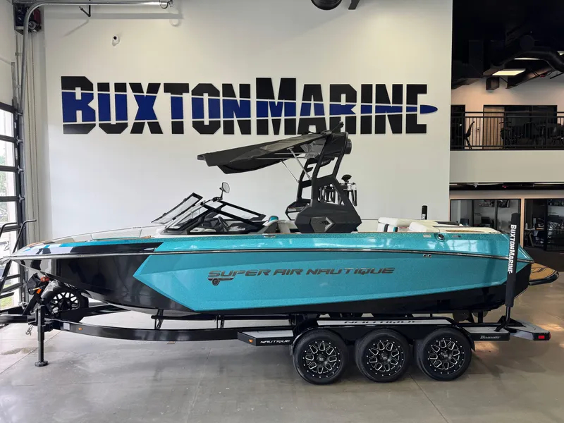 Slide: The Image of 2019 Nautique Super Air Nautique G25 boat displayed at Buxton Marine showroom. - 1