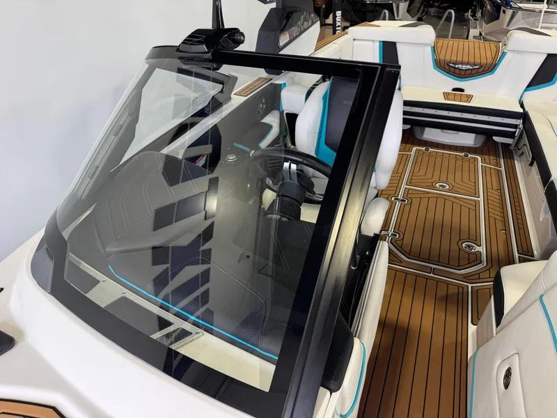 Slide: The Image of 2019 Nautique Super Air Nautique G25 interior with sleek design and wood-style flooring. - 20