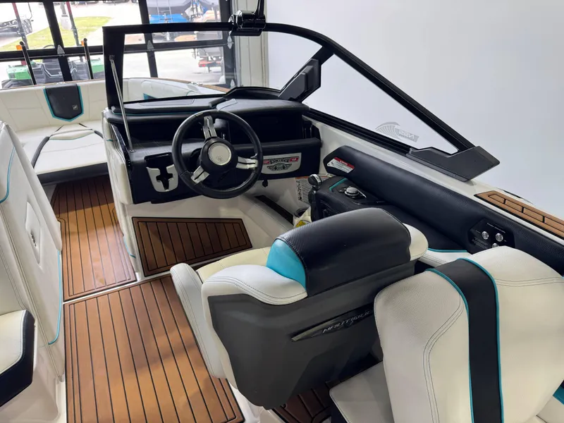 Slide: The Image of 2019 Nautique Super Air Nautique G25 interior with sleek design and modern dashboard. - 24