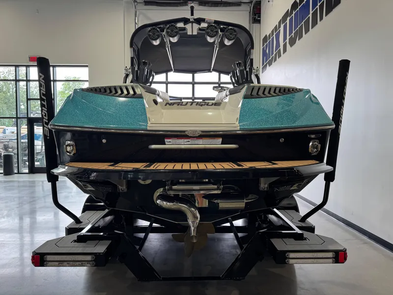 Slide: The Image of 2019 Nautique Super Air Nautique G25 boat in showroom, rear view. - 6