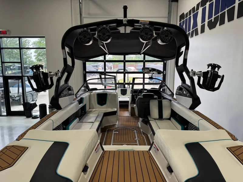 Slide: The Image of 2019 Nautique Super Air Nautique G25 interior with luxury seating and advanced sound system. - 9