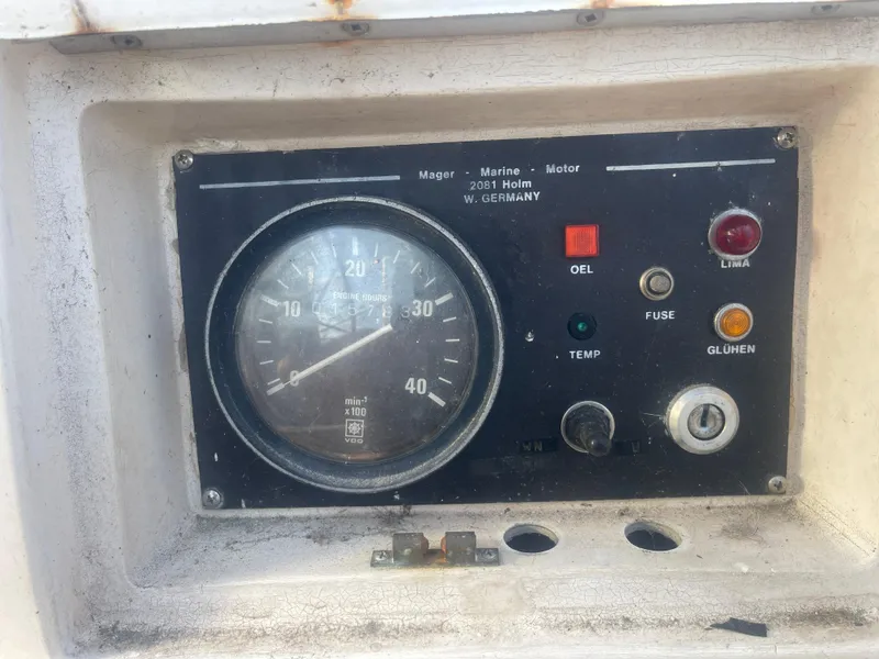 Slide: The Image of Control panel of a 1984 Hanseat 37 boat, featuring gauges and indicator lights. - 13