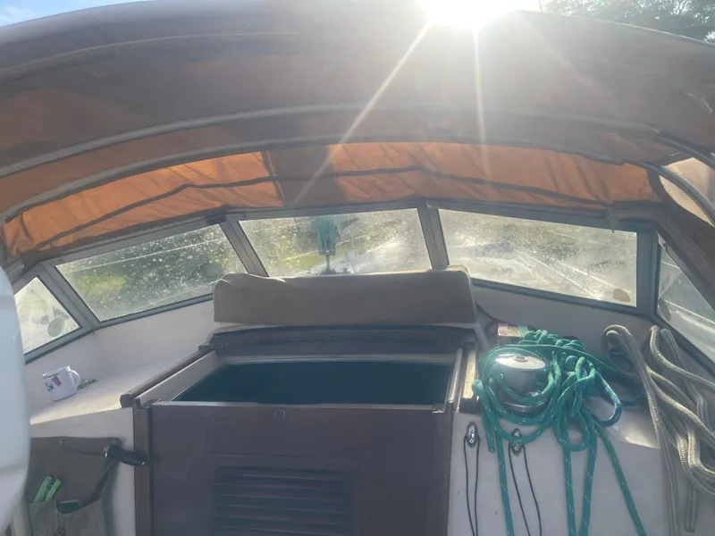 Slide: The Image of Cockpit of 1984 Hanseat 37 sailboat with sunlight streaming through windows. - 14