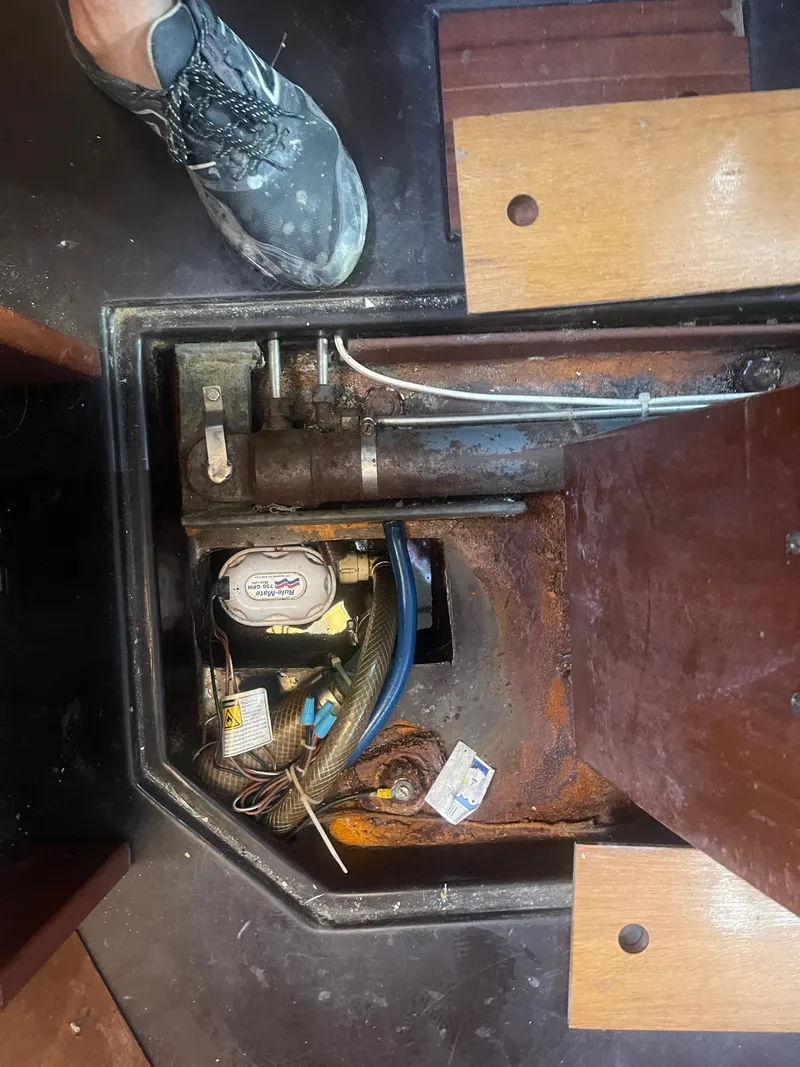 Slide: The Image of Engine compartment of a 1984 Hanseat 37 sailboat, showing mechanical components and wiring. - 15