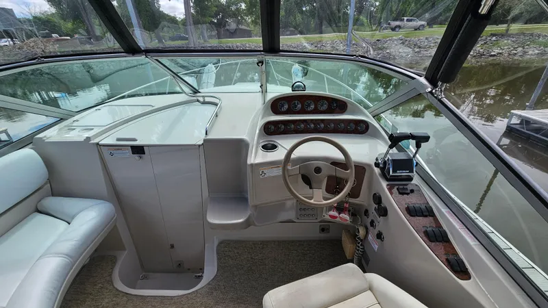 Slide: The Image of 1995 Regal Commodore 292 boat cockpit with steering wheel and instrument panel. - 12