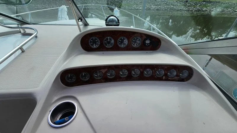 Slide: The Image of Dashboard of a 1995 Regal Commodore 292 boat with gauges and controls. - 13