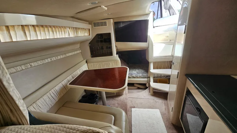 Slide: The Image of Interior of 1995 Regal Commodore 292 boat with seating and table. - 21