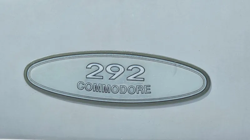 Slide: The Image of 1995 Regal Commodore 292 emblem on a white surface. - 28
