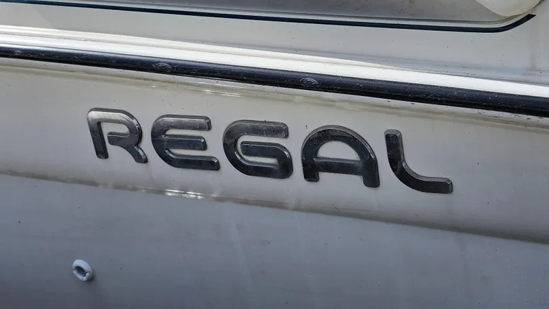 Slide: The Image of Close-up of 1995 Regal Commodore 292 boat logo on hull. - 29