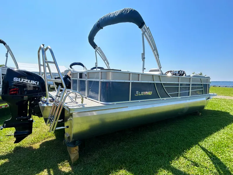 Slide: The Image of 2023 Landau Island Breeze 232 Cruise pontoon boat on grass with Suzuki outboard motor. - 4