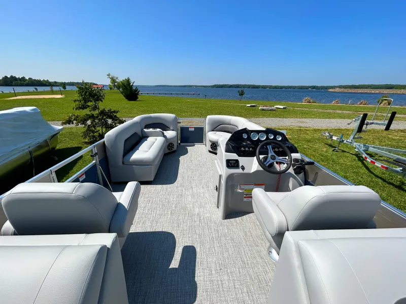 Slide: The Image of 2023 Landau Island Breeze 232 Cruise pontoon boat interior with lake view. - 8