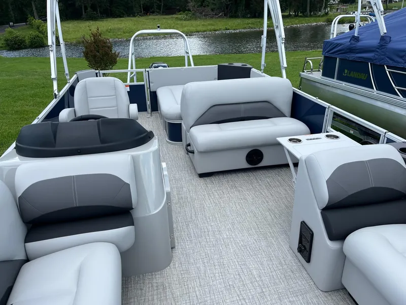 Slide: The Image of 2025 Landau Island Breeze 232 Cruise pontoon boat with spacious seating and modern design. - 3