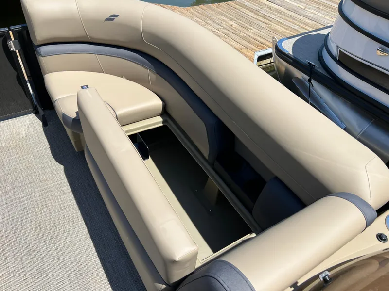 Slide: The Image of Luxurious seating on 2025 Starcraft EXS 3 Q DH boat, featuring beige upholstery. - 13