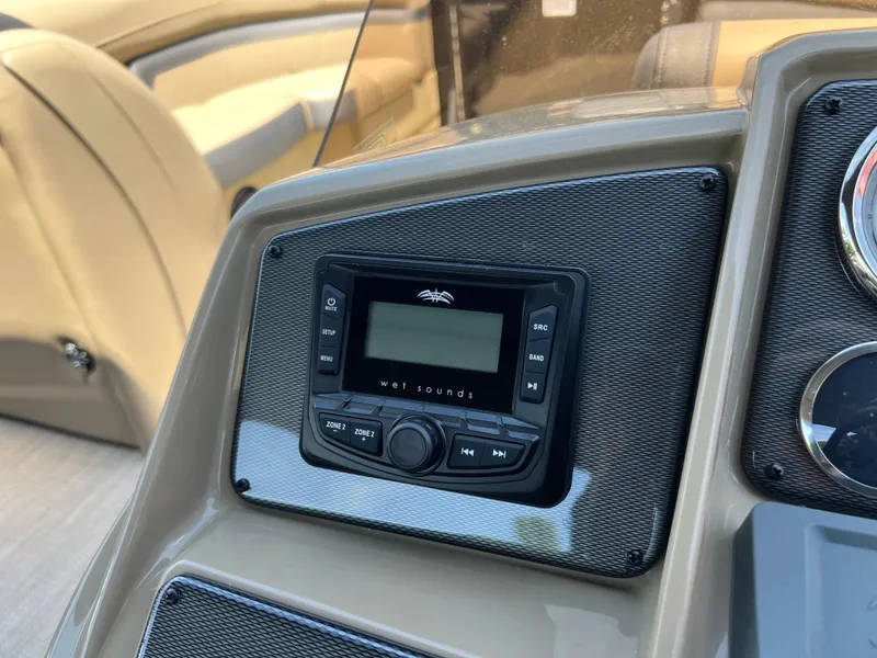 Slide: The Image of 2025 Starcraft EXS 3 Q DH boat dashboard with audio system. - 5