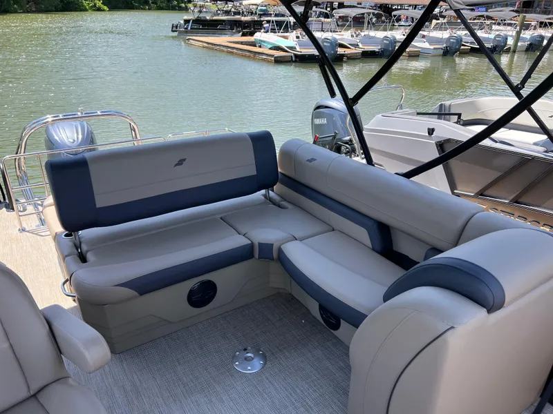 Slide: The Image of Luxurious seating on 2025 Starcraft EXS 3 Q DH boat, docked by a serene lake. - 9
