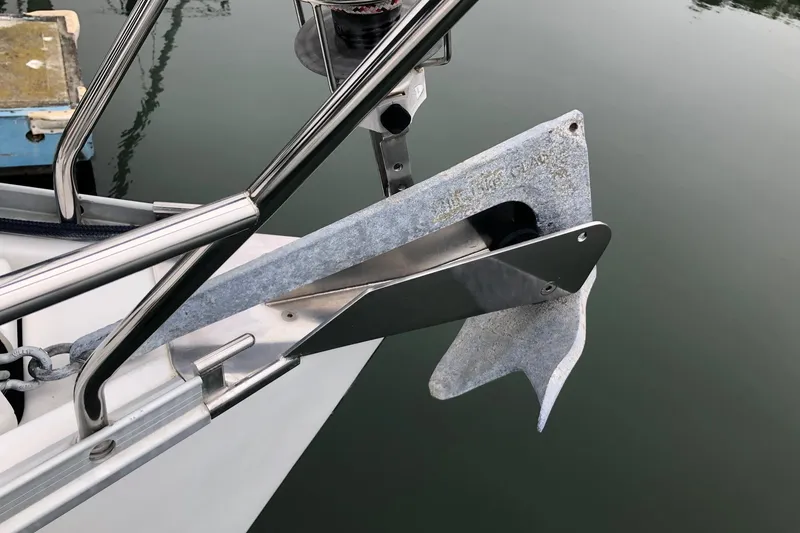 Slide: The Image of Anchor of a 2001 Beneteau 361 sailboat, secured on a calm water surface. - 16