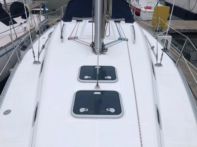 Slide: The Image of 2001 Beneteau 361 sailboat deck with hatches and rigging, docked at marina. - 19