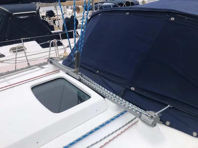 Slide: The Image of Beneteau 361 sailboat deck with blue canopy and hatch, 2001 model. - 22
