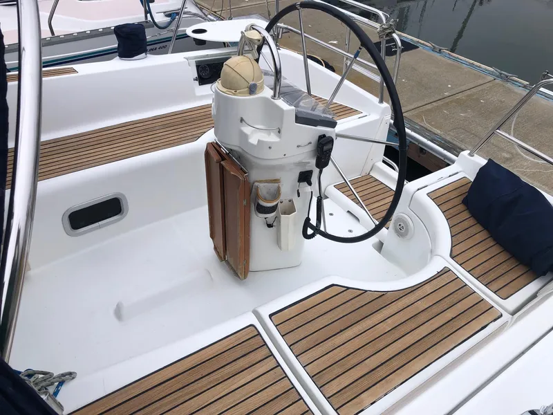 Slide: The Image of Cockpit of 2001 Beneteau 361 sailboat with wooden deck and steering wheel. - 27