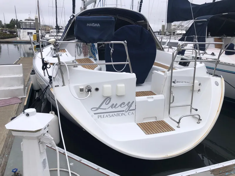 Slide: The Image of 2001 Beneteau 361 sailboat docked, featuring a spacious deck and elegant design. - 28