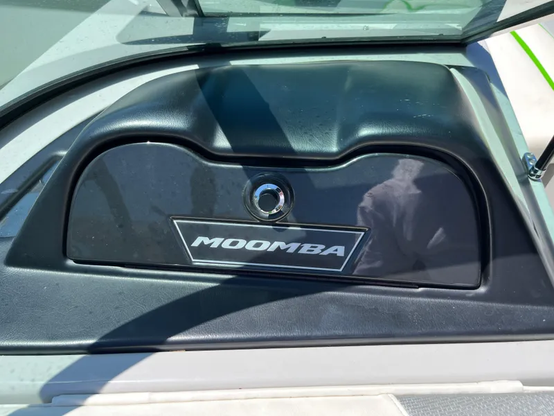 Slide: The Image of 2016 Moomba Mojo dashboard with logo, featuring sleek black design. - 13