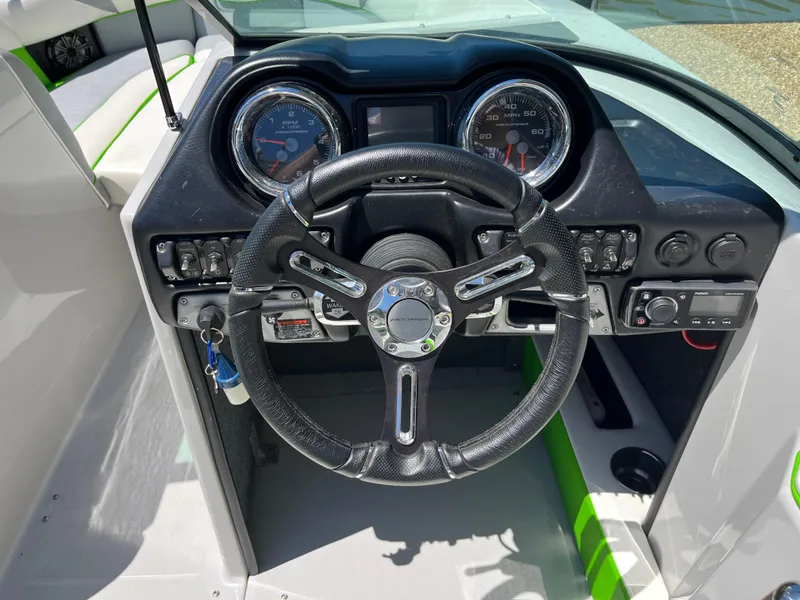 Slide: The Image of 2016 Moomba Mojo boat dashboard with steering wheel and instrument panel. - 20