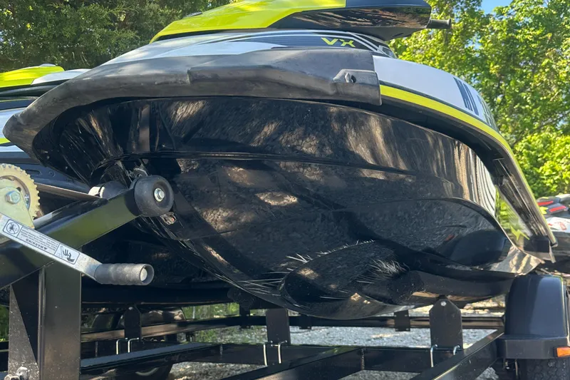 Slide: The Image of 2021 Yamaha WaveRunner VX on trailer, showcasing sleek black hull design. - 12