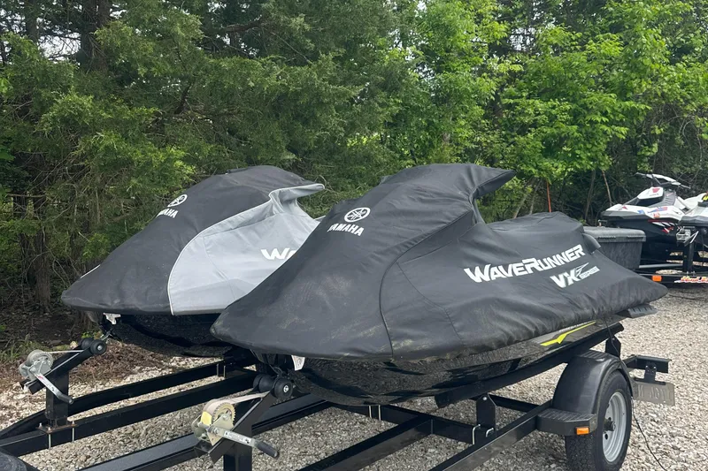 Slide: The Image of 2021 Yamaha WaveRunner VX jet skis covered on trailers, parked outdoors. - 16