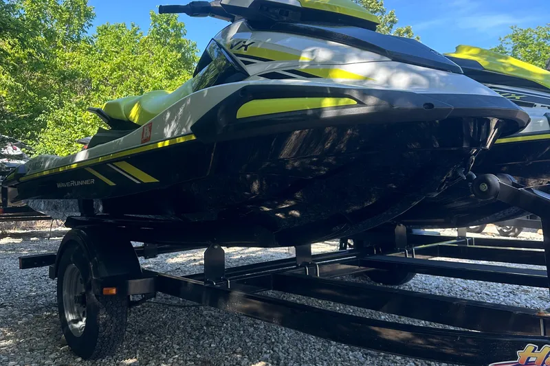 Slide: The Image of 2021 Yamaha WaveRunner VX on trailer, parked outdoors with trees in background. - 2
