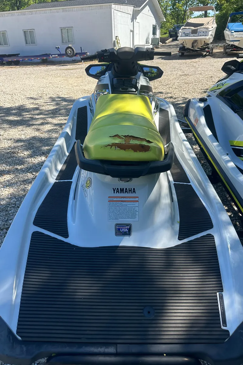Slide: The Image of 2021 Yamaha WaveRunner VX with yellow seat, parked outdoors. - 6