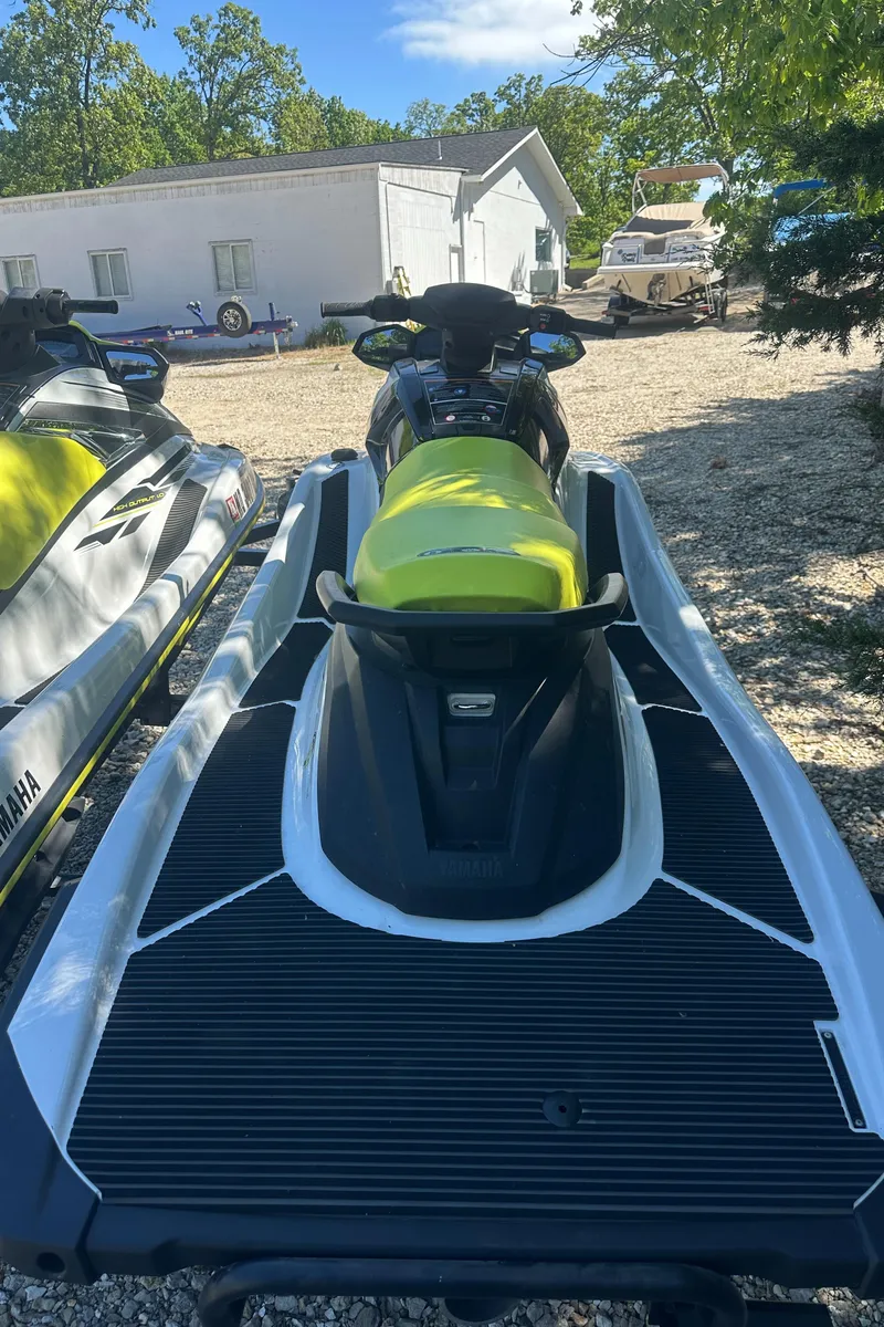Slide: The Image of 2021 Yamaha WaveRunner VX jet ski with vibrant yellow seat, parked outdoors. - 7