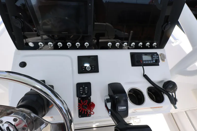 Slide: The Image of 2020 Sportsman Heritage 211 Center Console dashboard with controls and navigation equipment. - 28