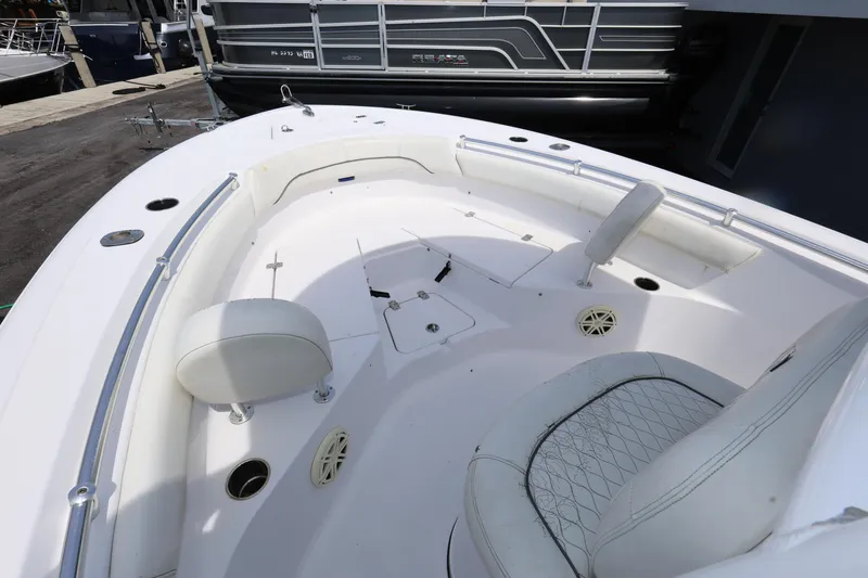Slide: The Image of 2020 Sportsman Heritage 211 Center Console boat interior with seating and storage compartments. - 30