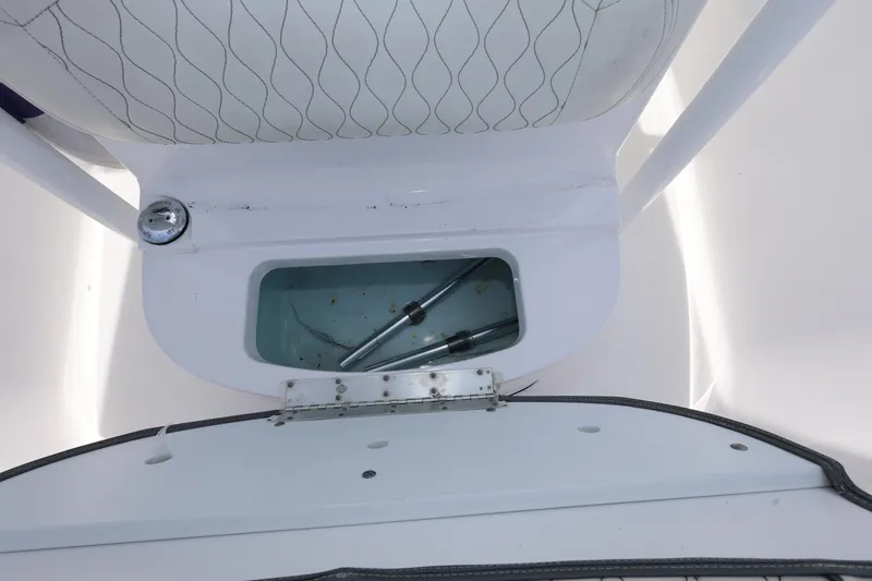 Slide: The Image of 2020 Sportsman Heritage 211 Center Console boat storage compartment with hydraulic struts. - 33