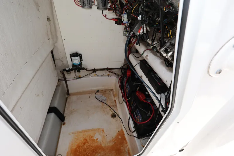 Slide: The Image of 2020 Sportsman Heritage 211 Center Console wiring and battery compartment. - 34