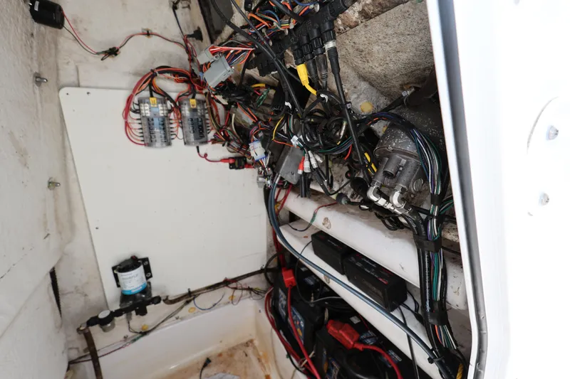 Slide: The Image of 2020 Sportsman Heritage 211 Center Console wiring and electrical components inside the boat. - 35
