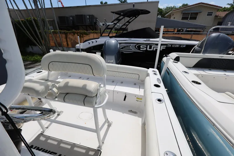 Slide: The Image of 2020 Sportsman Heritage 211 Center Console boat interior with cushioned seating. - 36