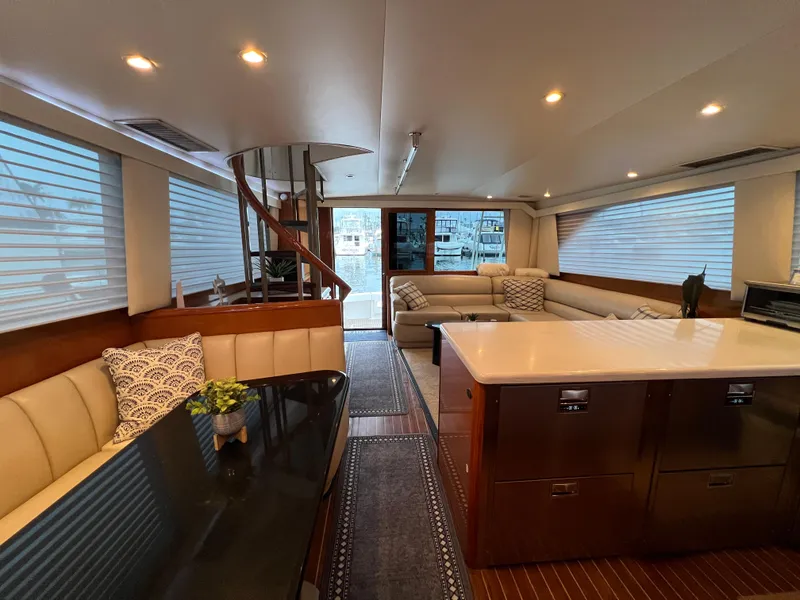 Slide: The Image of Luxurious interior of 2000 Viking 58 Enclosed Bridge yacht with elegant seating and modern decor. - 10