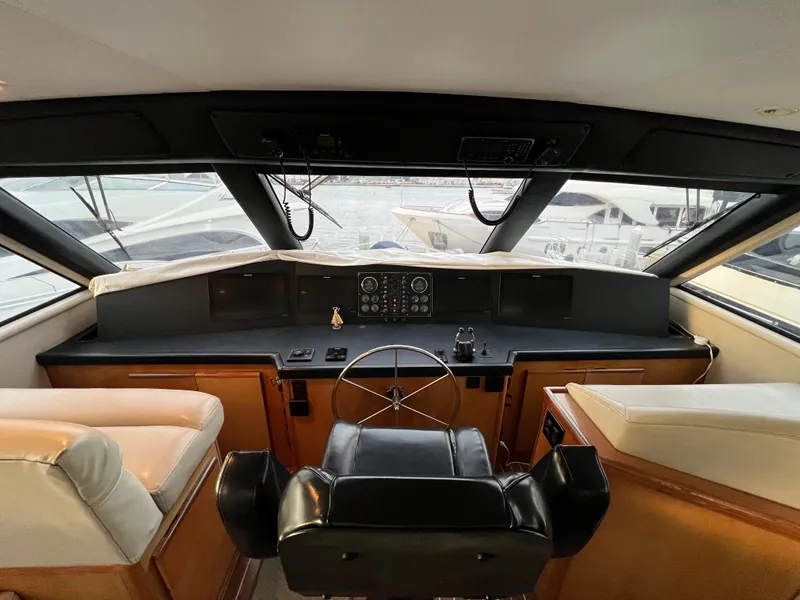 Slide: The Image of Interior helm of 2000 Viking 58 Enclosed Bridge yacht with steering wheel and dashboard. - 30