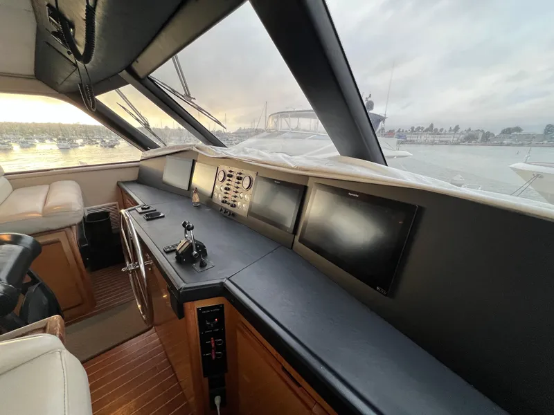 Slide: The Image of Interior view of 2000 Viking 58 Enclosed Bridge yacht cockpit with navigation equipment. - 33