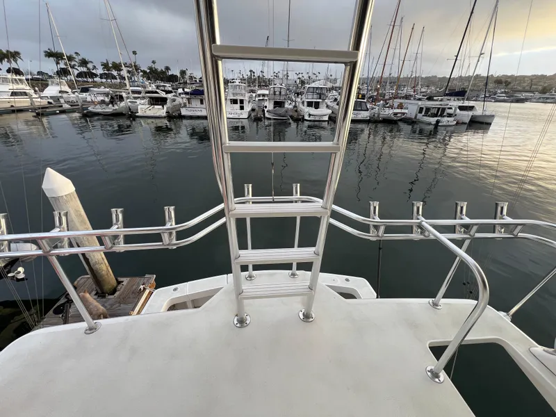 Slide: The Image of View from Viking 58 Enclosed Bridge yacht, overlooking marina with numerous docked boats. - 43