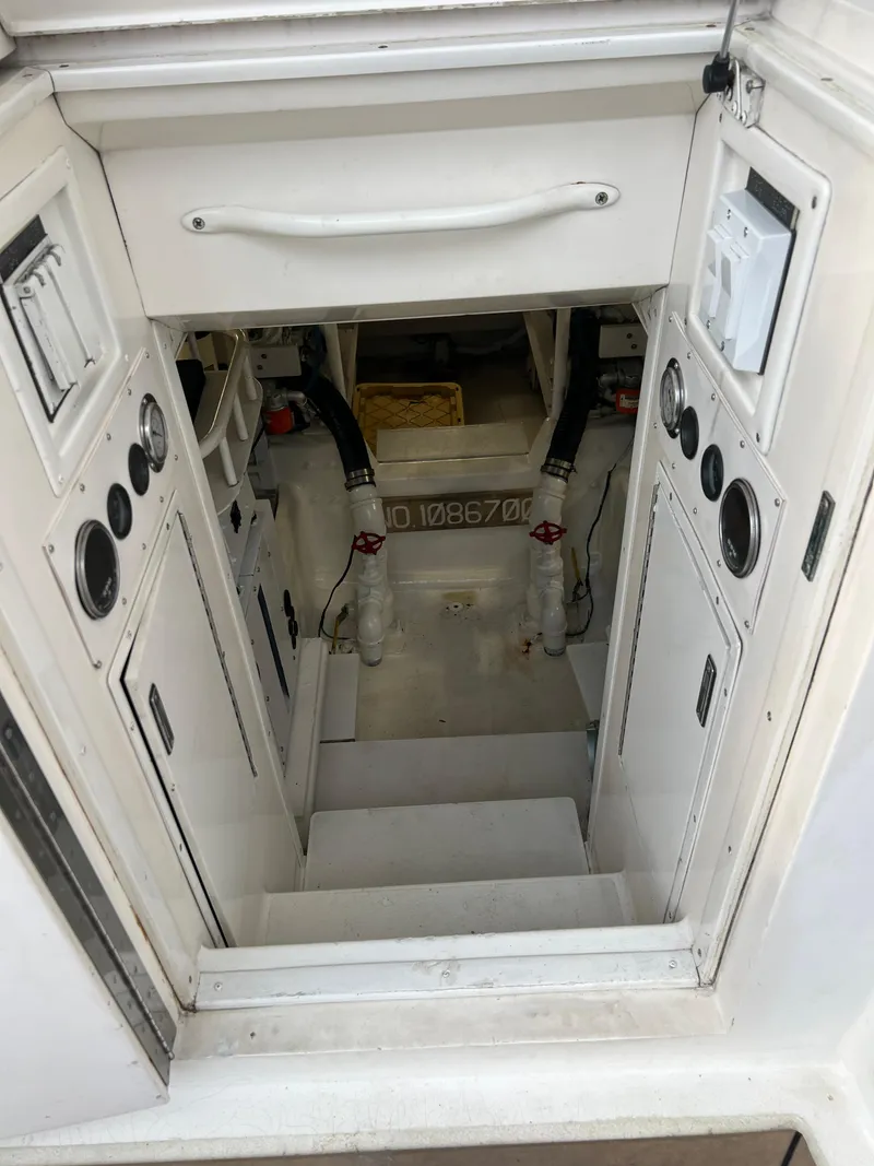 Slide: The Image of Engine room access on a 2000 Viking 58 Enclosed Bridge yacht. - 48