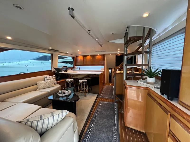 Slide: The Image of Luxurious interior of 2000 Viking 58 Enclosed Bridge yacht with modern furnishings and elegant design. - 7