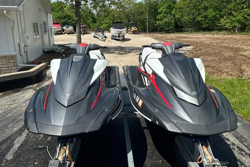 Slide: The Image of Two 2019 Yamaha WaveRunner VX Cruiser HO jet skis parked outdoors. - 2